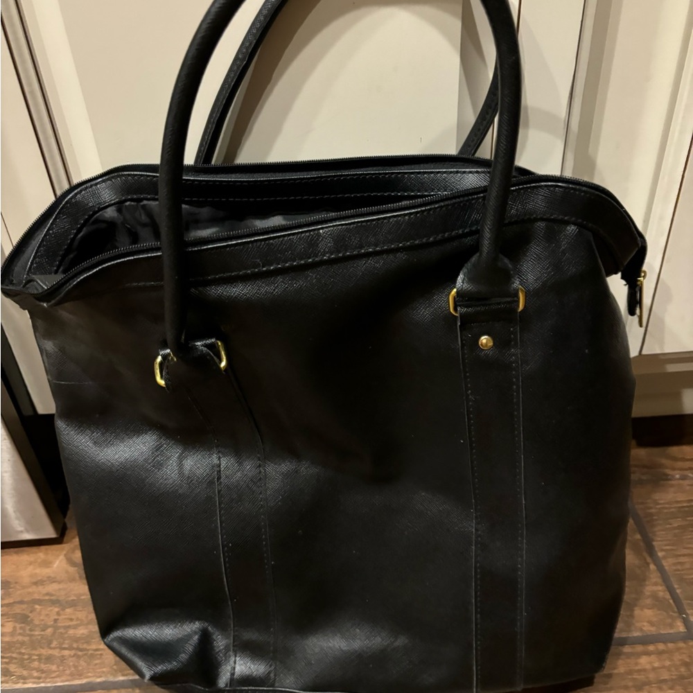 New black briefcase. Can be used as an oversized purse also.